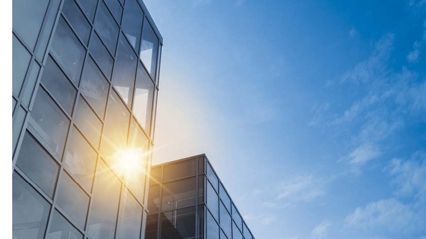 Windows of Skyscraper Business Office with blue sky, Corporate building in city.
